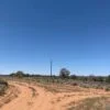 Powerlines at entrance of oil field road